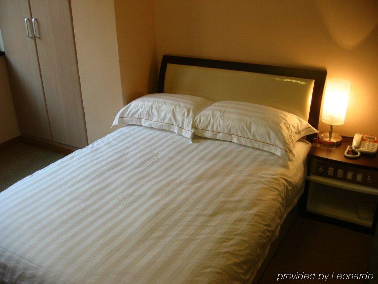 Jiujiu Holiday Hotel Shanghai Camera foto