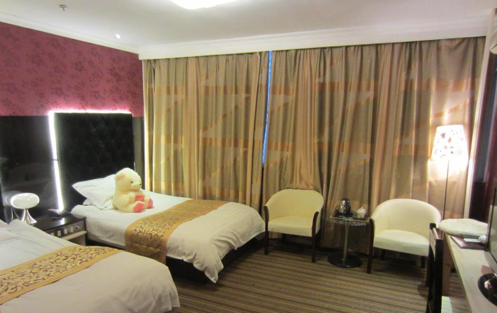 Jiujiu Holiday Hotel Shanghai Camera foto