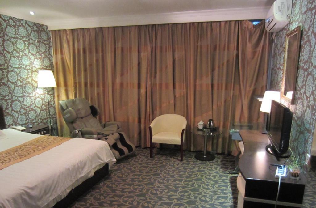 Jiujiu Holiday Hotel Shanghai Camera foto